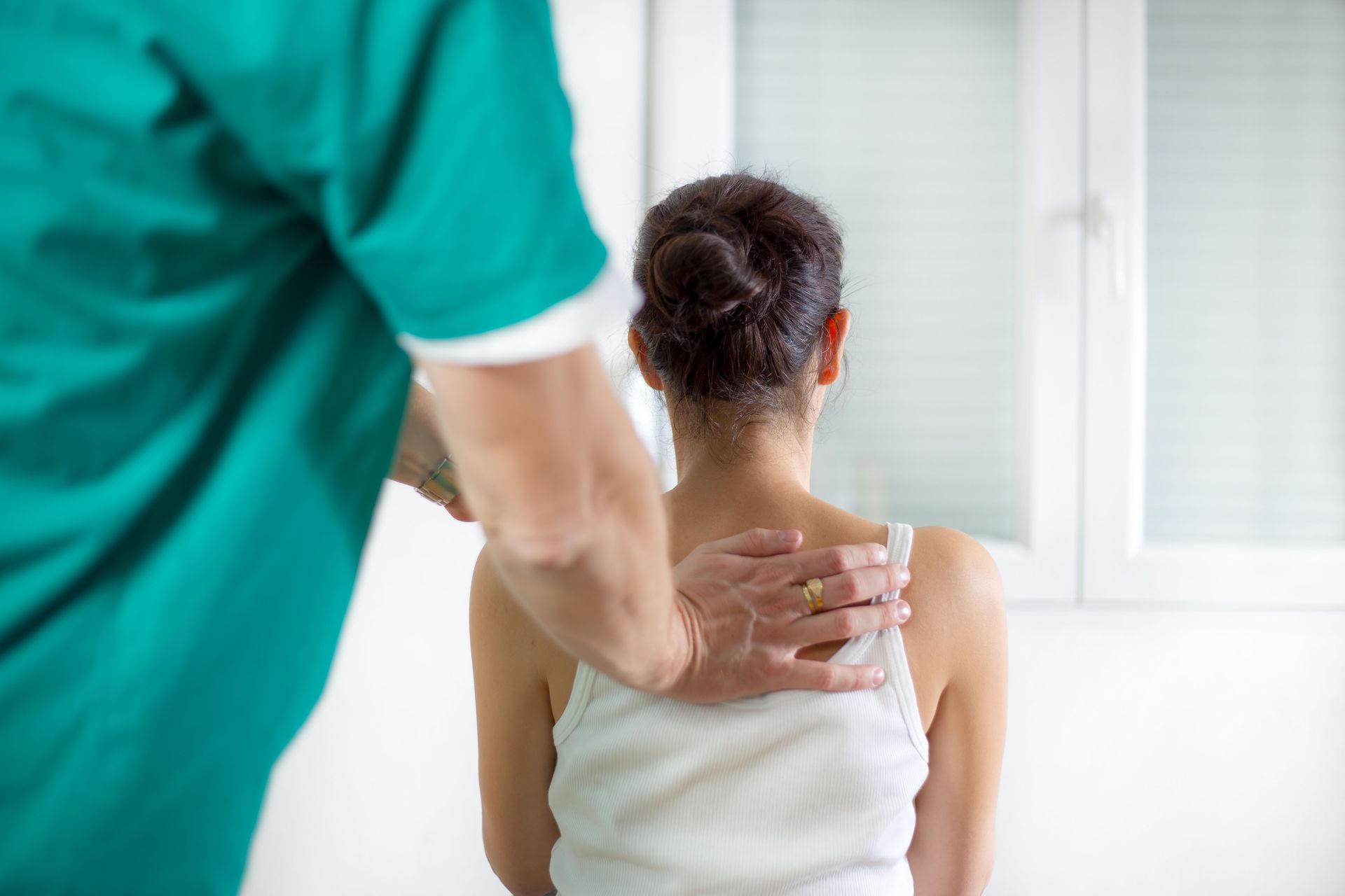 Chiropractor performing a gentle spinal adjustment